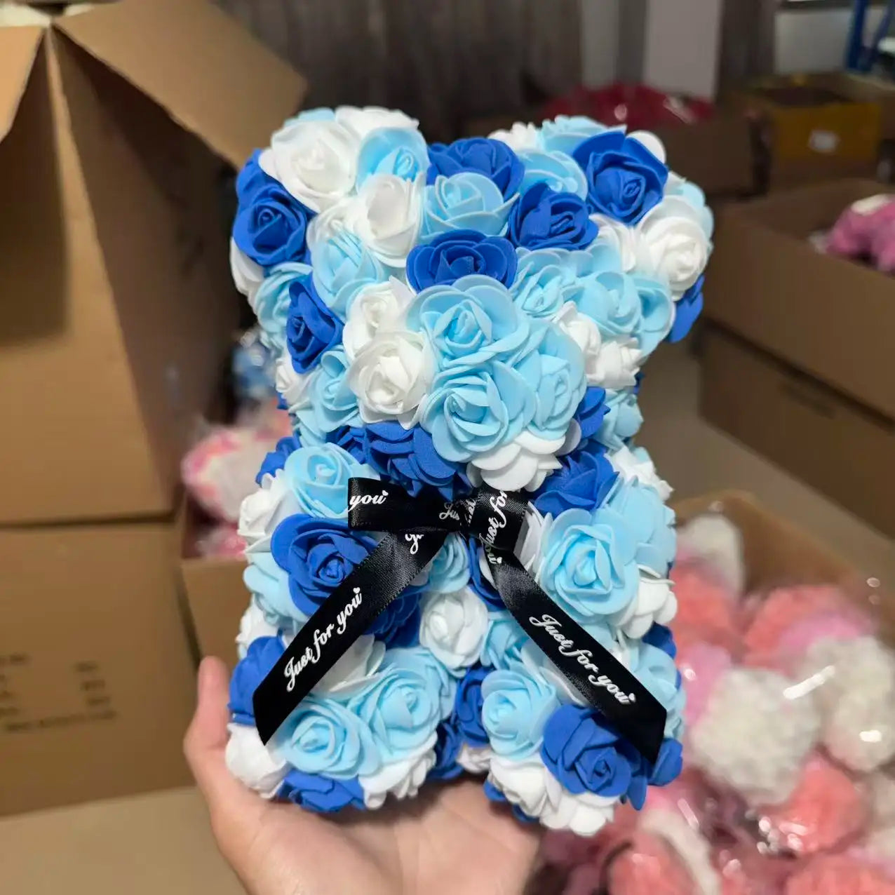 Oso de flor rosa de peluche