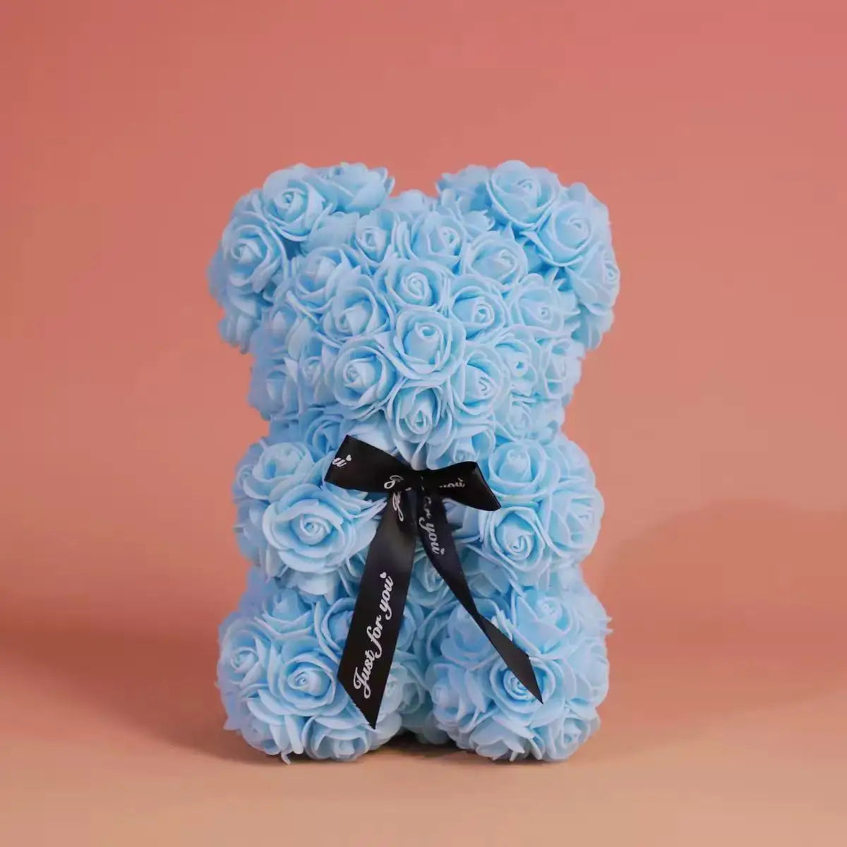 Oso de flor rosa de peluche