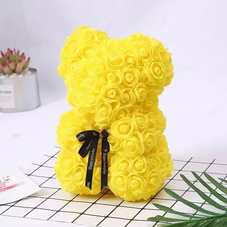 Oso de flor rosa de peluche