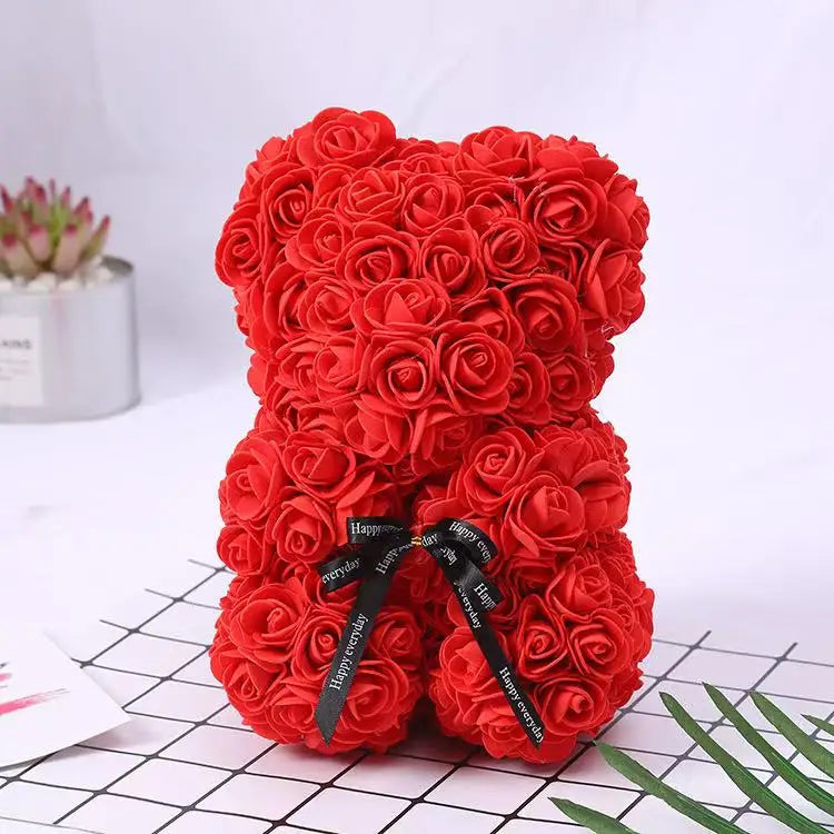 Oso de flor rosa de peluche