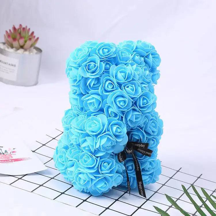 Oso de flor rosa de peluche