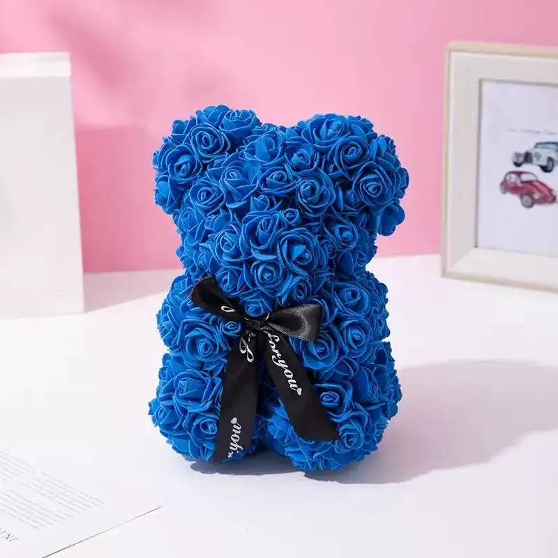 Oso de flor rosa de peluche