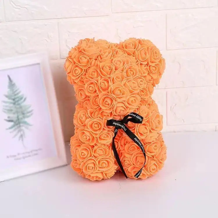Oso de flor rosa de peluche