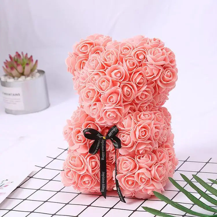 Oso de flor rosa de peluche