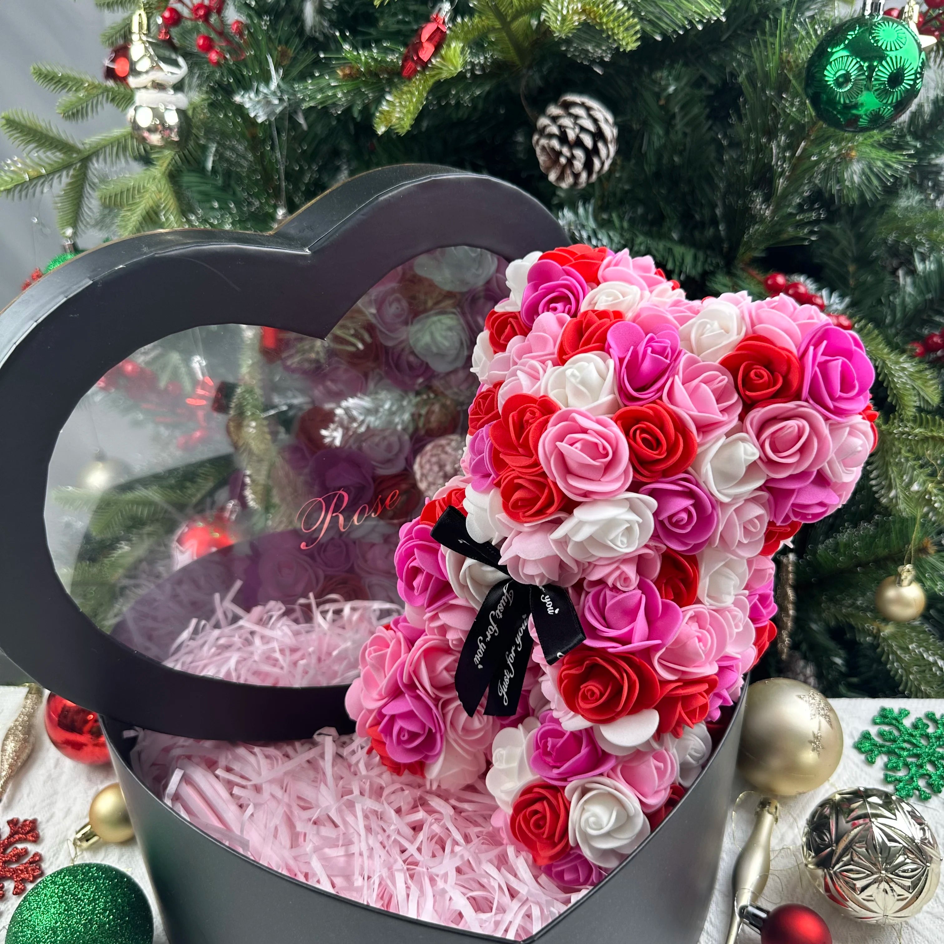 Oso de flor rosa de peluche