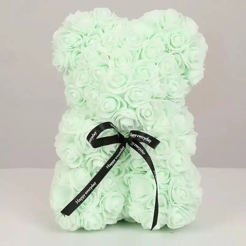 Oso de flor rosa de peluche