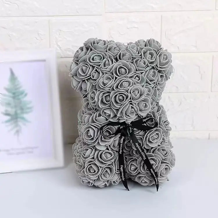 Oso de flor rosa de peluche