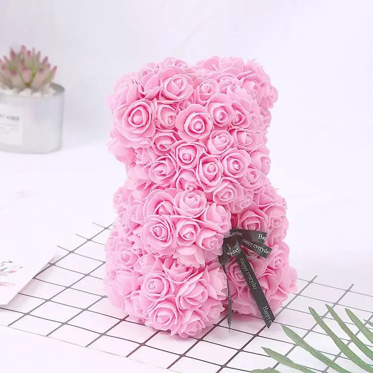 Oso de flor rosa de peluche