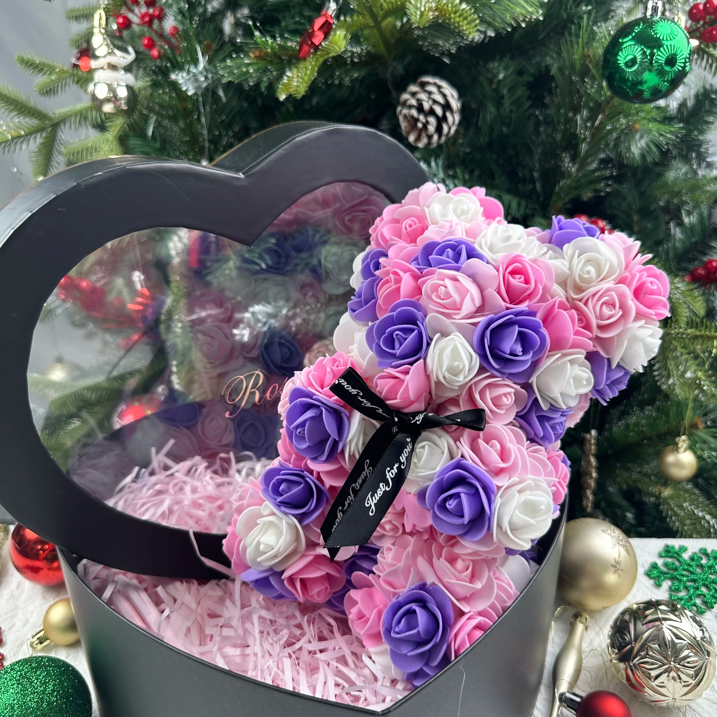 Oso de flor rosa de peluche