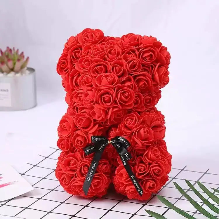 Oso de flor rosa de peluche