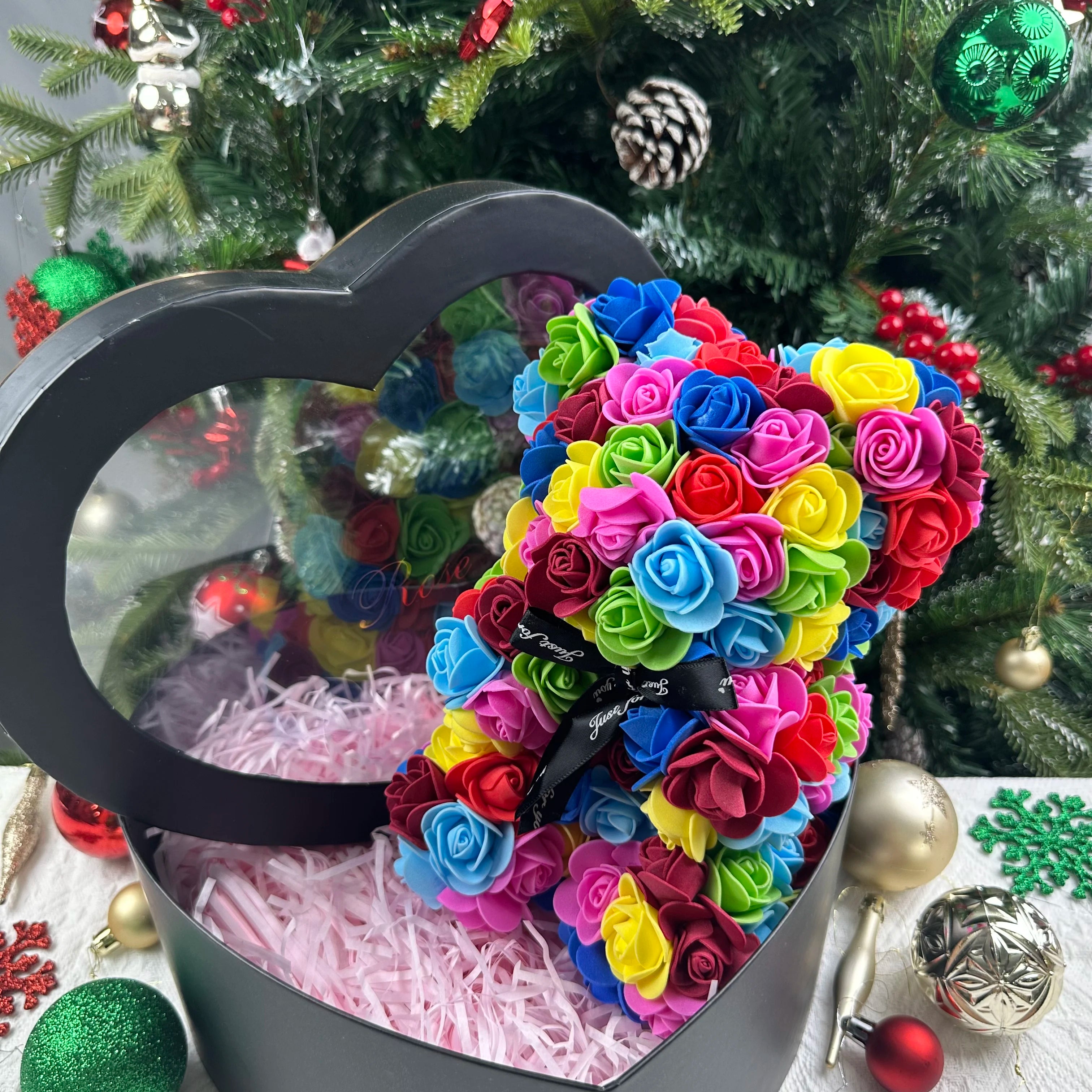 Oso de flor rosa de peluche
