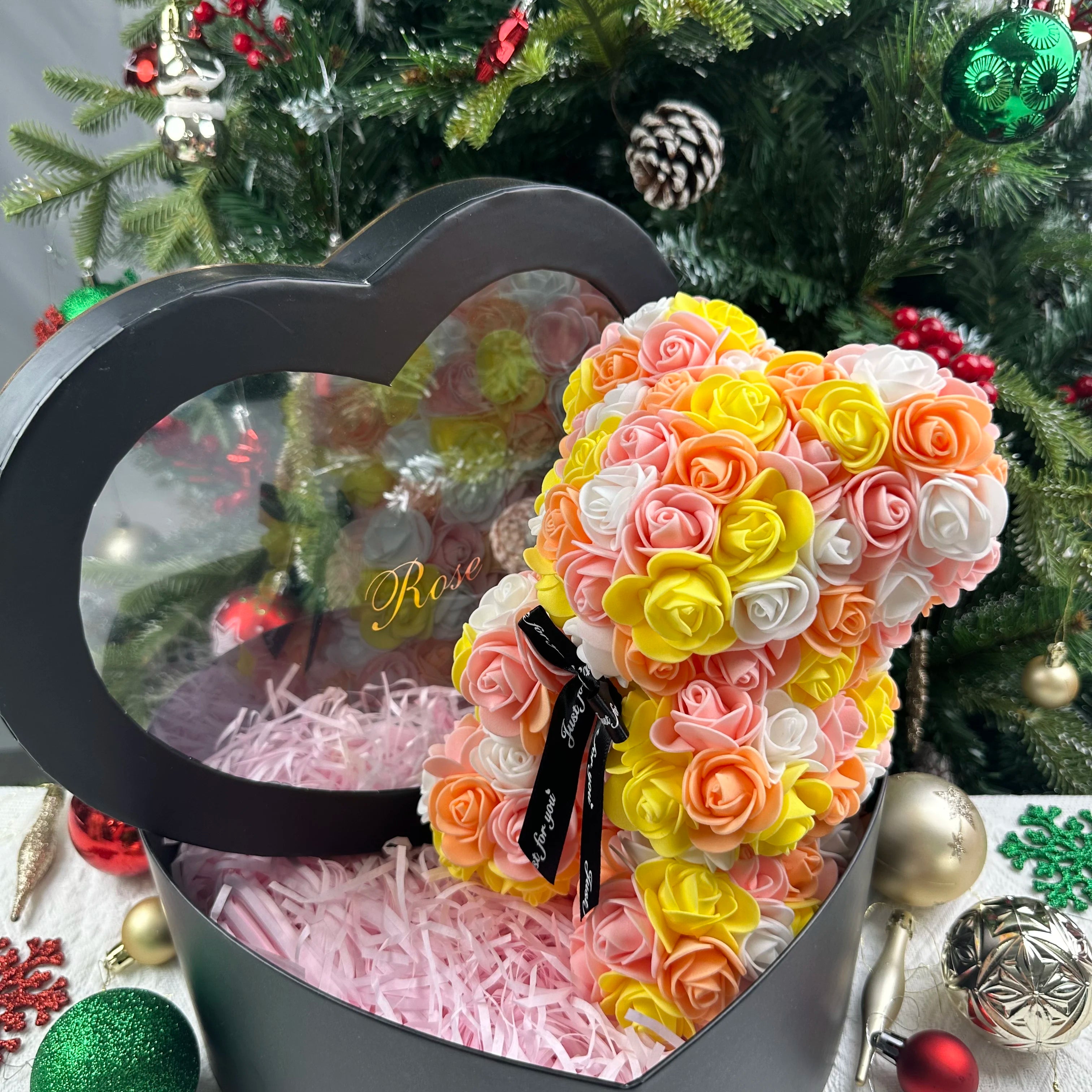 Oso de flor rosa de peluche