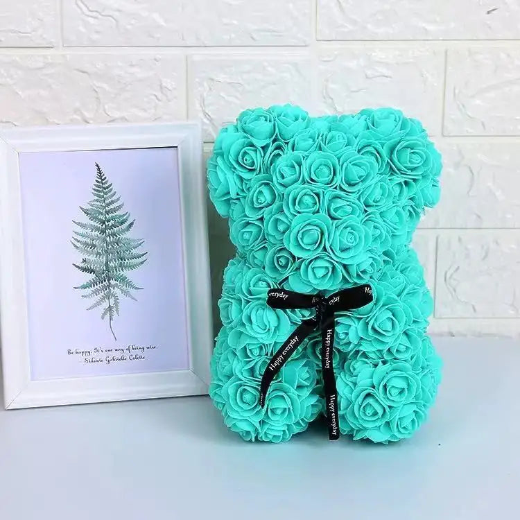 Oso de flor rosa de peluche