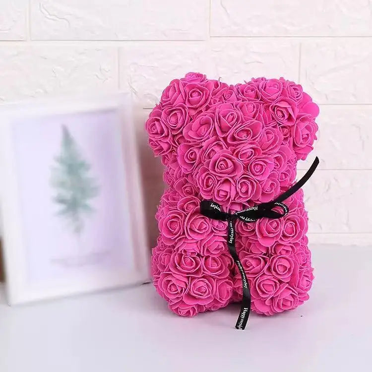 Oso de flor rosa de peluche