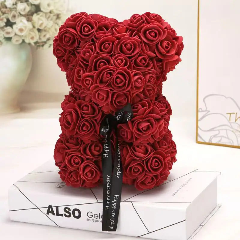 Oso de flor rosa de peluche