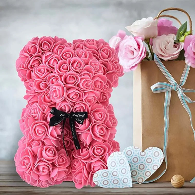 Oso de flor rosa de peluche