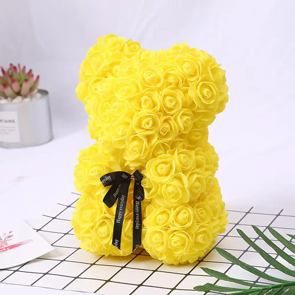 Oso de flor rosa de peluche