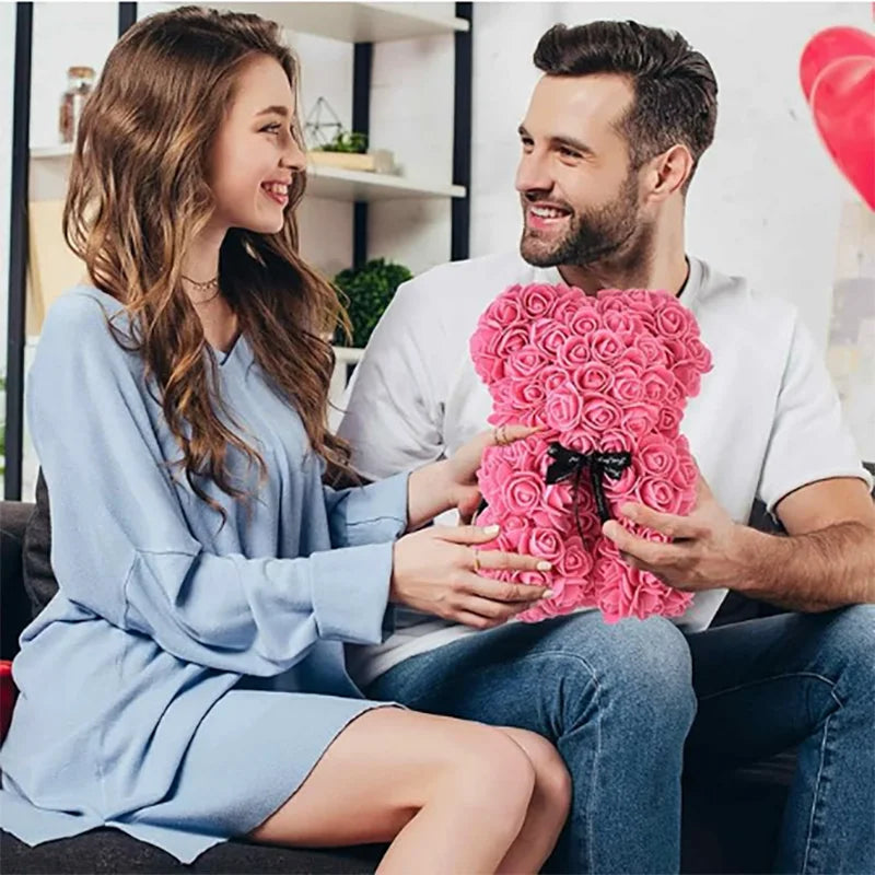 Oso de flor rosa de peluche