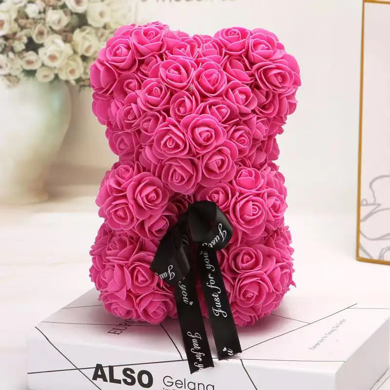 Oso de flor rosa de peluche
